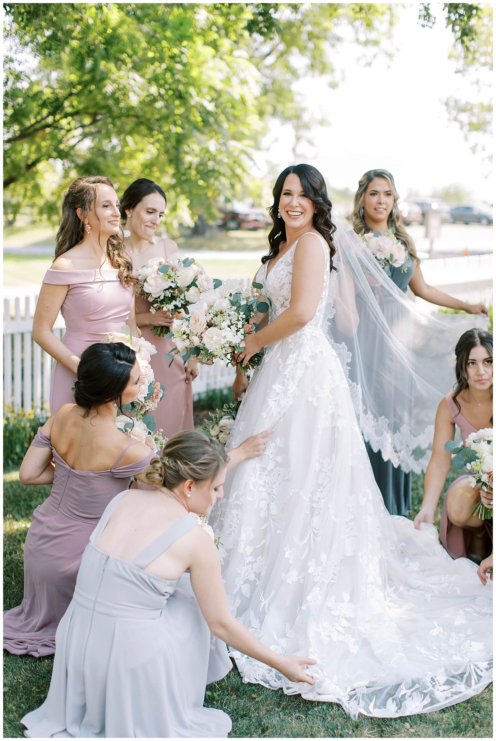Bride getting dressed with her bridesmaids on her wedding day at Stone Tower Winery